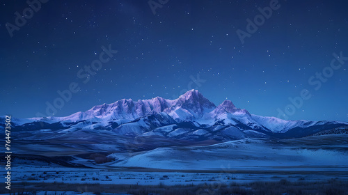 Mountain peaks bathed in the gentle glow of moonlight, creating a serene and majestic nighttime scene