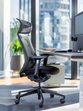 An ergonomic office chair and stylish desk accessories define a professional workspace, marrying modern design with comfort for productivity and wellbeing.