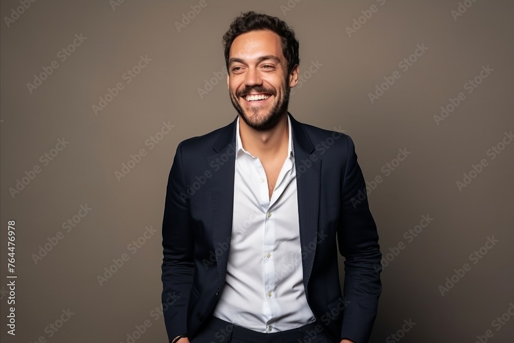 Portrait of a happy young man in suit. Studio shot. Portrait of a happy young man in suit. Studio shot.