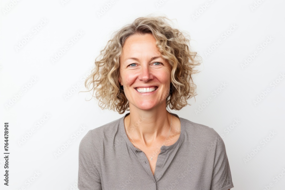 Portrait of a smiling middle-aged woman on a white background Portrait of a smiling middle-aged woman on a white background