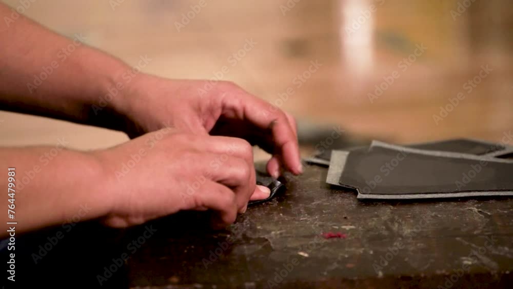 Process of making a travel bag made of genuine leather, professional leatherwork, family business,
in his workshop Process of making a travel bag made of genuine leather, professional leatherwork, family business,
in his workshop