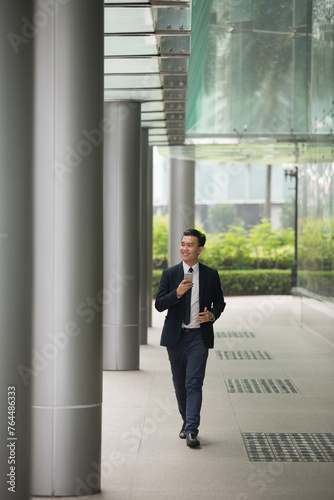 Chinese business man in modern Asian city