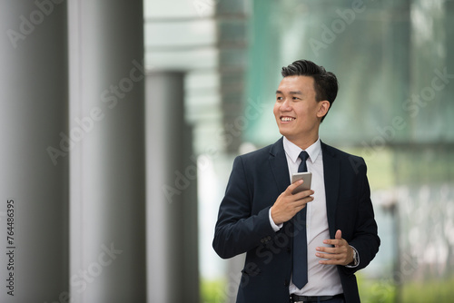 Chinese business man in modern Asian city