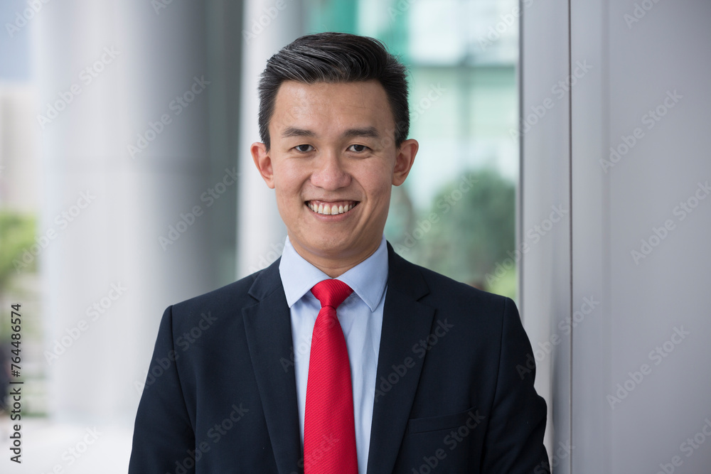 Chinese business man in modern Asian city Chinese business man in modern Asian city