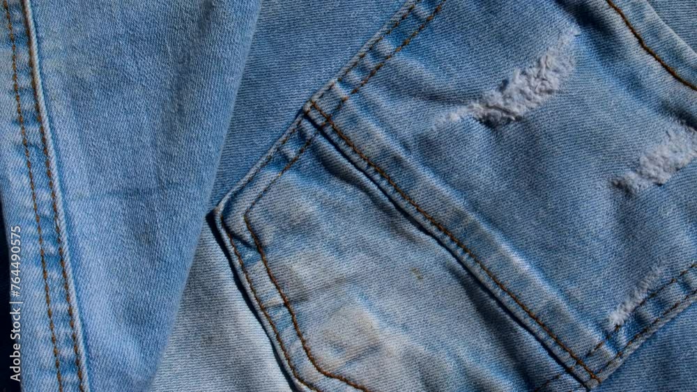 Exquisite stitching detail on denim, capturing the craftsmanship and unique texture of the fabric. Exquisite stitching detail on denim, capturing the craftsmanship and unique texture of the fabric.