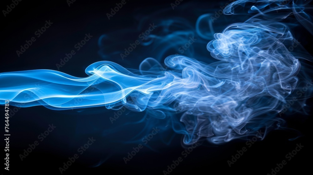  A close-up of blue and white smoke on a black background, with a black backdrop