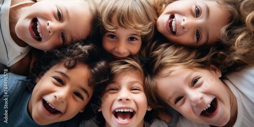 Group of children are smiling and hugging each other