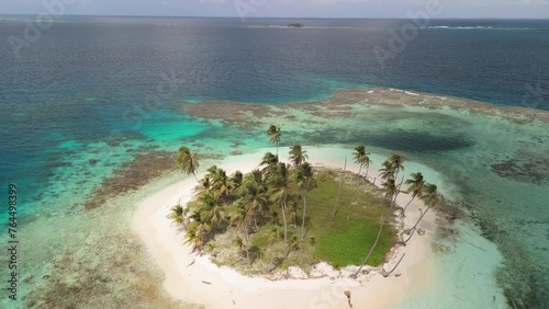 Drone clip from a remote island with crystal water in San Blas archipelago. photo
