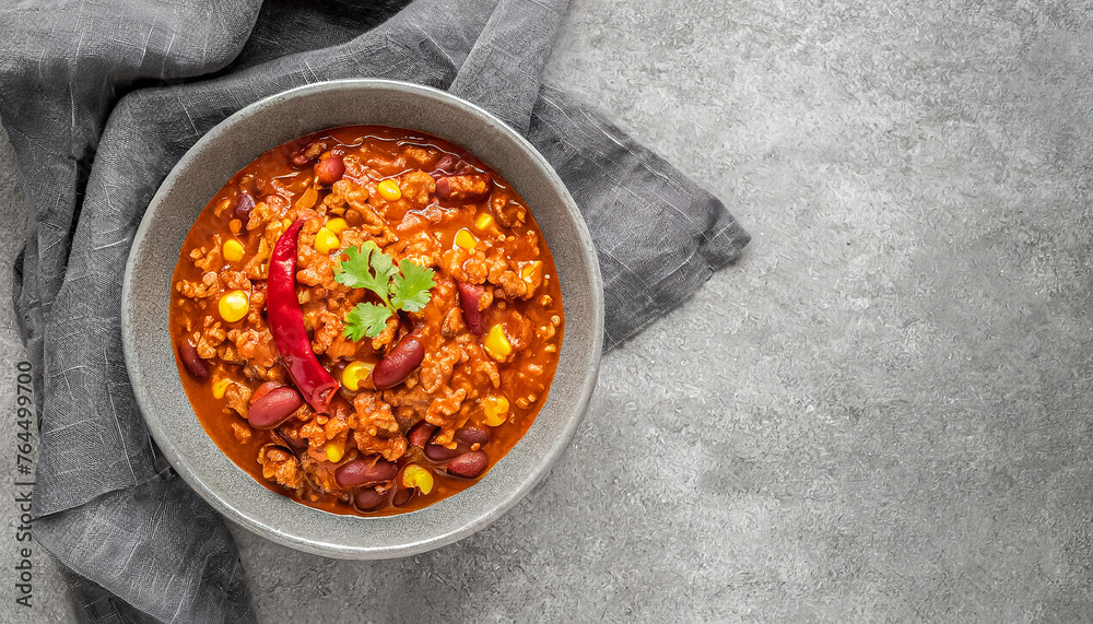 beef chili. top view of homemade beef chili con carne on grey bowl, copy space beef chili. top view of homemade beef chili con carne on grey bowl, copy space