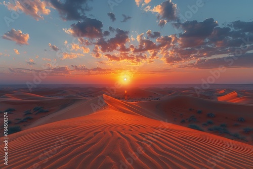 Sunset over the undulating sand dunes of a vast desert.