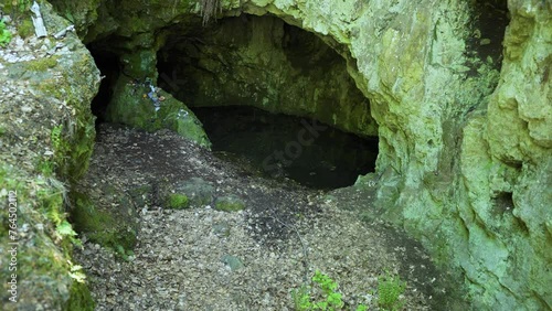 Entrance of a cave known as the location of the tomb of the Egyptian warrior goddess Bastet, located in the frorest of Strandzha Mountain in Bulgaria. photo