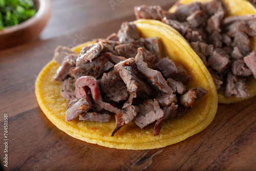 A closeup view of carne asada tacos. photo