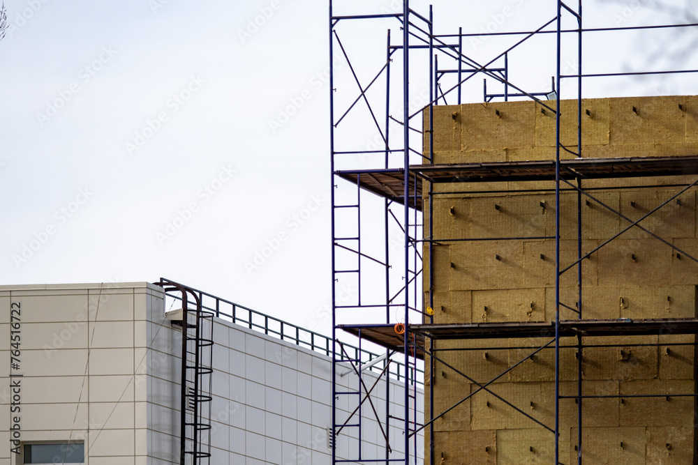 High-rise building against the background of windows, architecture of new buildings. High-rise building against the background of windows, architecture of new buildings.