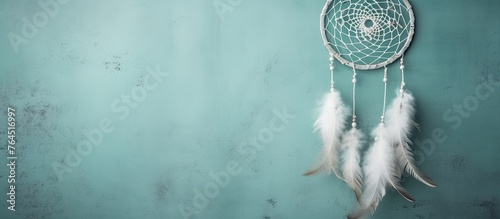 Capture a detailed view of a decorative dream catcher displayed on a wall in a close-up shot