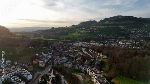 Aerial view of swiss small Town with hill and neighborhood at sunset time. Wald City, Switzerland. Wide shot.