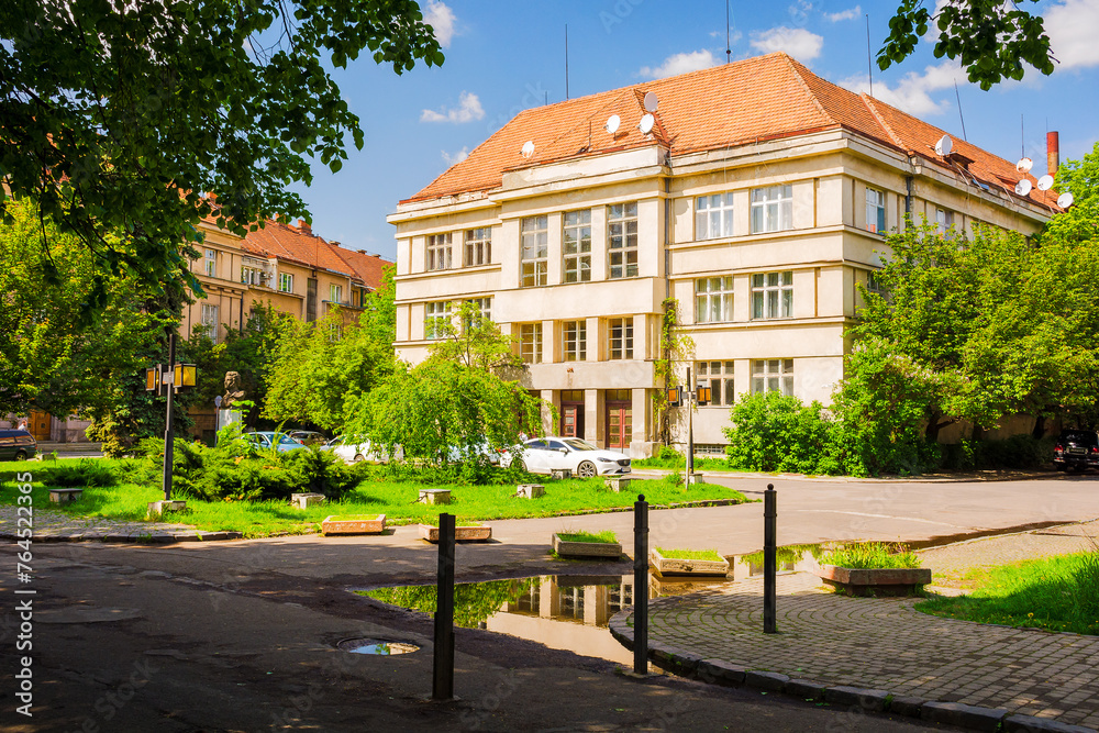 uzhhorod, ukraine - 06 may 2017: square in the small galagov near linden embankment. old architecture built under czechoslovakia rule