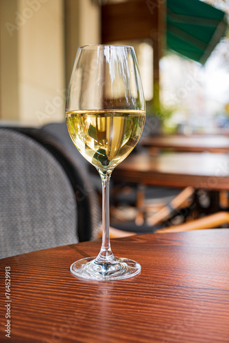 white wine on the wooden table