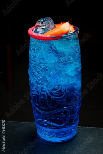 blue cocktail on the dark background