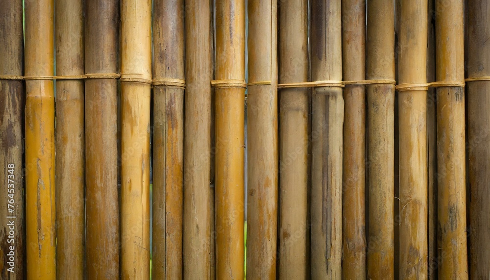 Fototapeta premium Nostalgic Nuance: Distressed Brown Tone Bamboo Fence Background