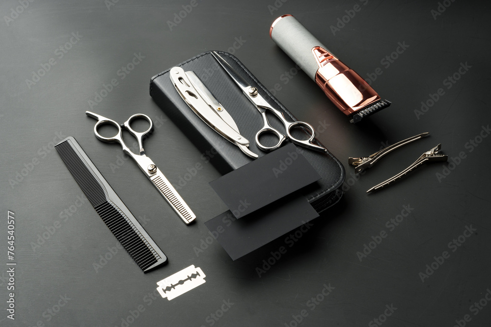 Naklejka premium Tools for barbershop on black background studio shot