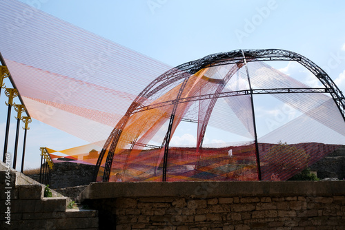 Fortress in Gjirokastra a huge stone building on a high mountain in Albania with a clock the history of the Middle Ages a beautiful view from the stone city to the ancient village photo