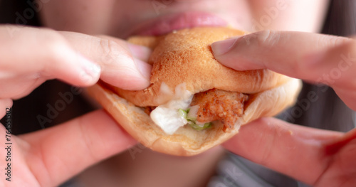 Women Eating Chicken Hamburger Blurred