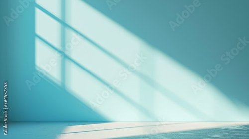 Play of light creating angular shadows on a vibrant blue wall and floor