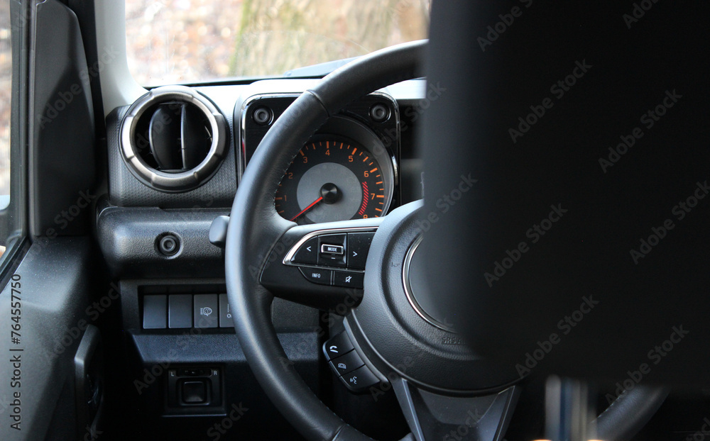 View From Behind The Headrest On A Dashboard And Steering Wheel In Off Road Car 
