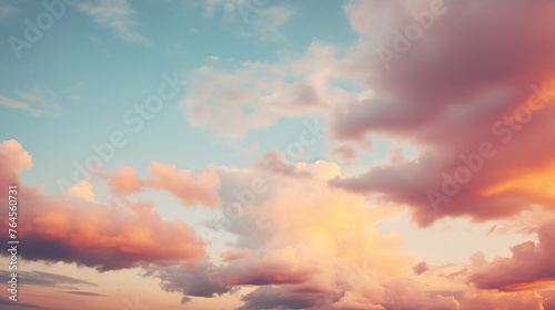 Calming cloud background with soft orange glow of a tranquil sunset