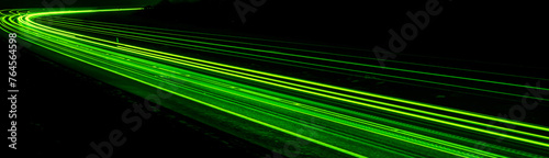 green car lights at night. long exposure