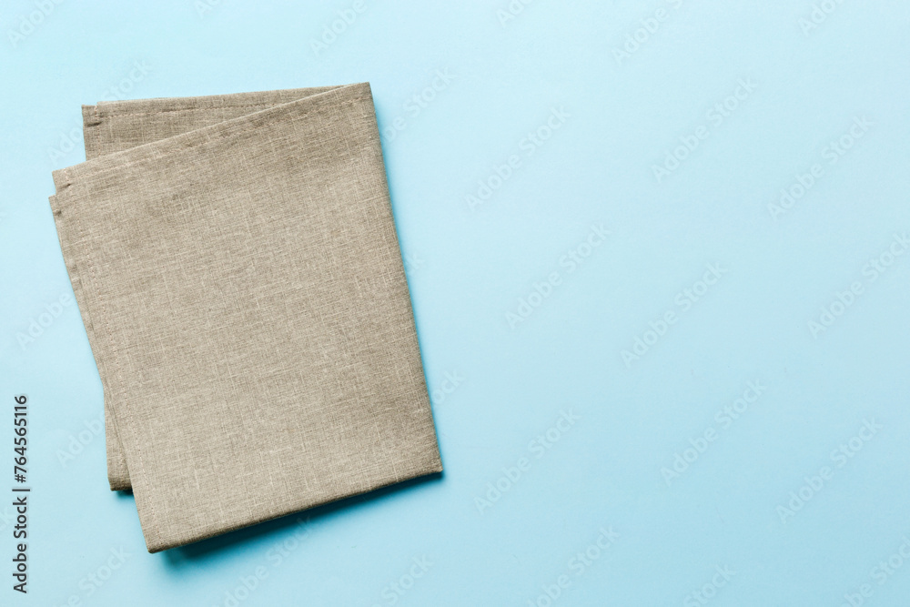 top view with gray kitchen napkin isolated on table background. Folded cloth for mockup with copy space, Flat lay. Minimal style