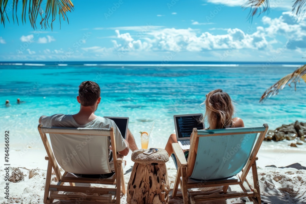 Seaside Serenity for Two: Couple Finds Work-Life Harmony with Remote Office on Tropical Beach - Embracing Productivity and Leisure in a Scenic Outdoor Setting for Modern Work and Lifestyle.