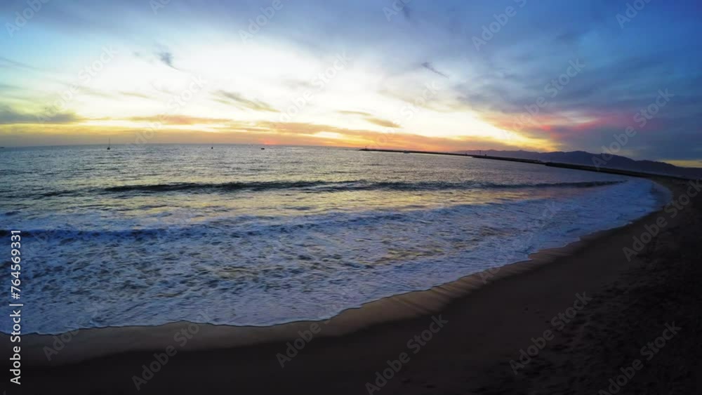 Aerial: Drone Panning Beautiful View Of Wavy Sea At Beach Under Cloudy Sky At Sunset - Playa del Rey, California Aerial: Drone Panning Beautiful View Of Wavy Sea At Beach Under Cloudy Sky At Sunset - Playa del Rey, California