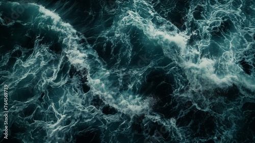 Dark ocean waves create intense textures, capturing nature's energy and chaos.