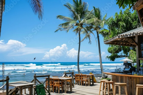 A beachfront cafe with panoramic ocean views  palm trees swaying in the breeze  and surfers catching waves in the distance  Generative AI