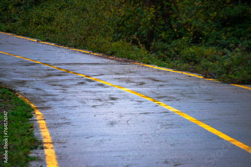 Detailed asphalt road profile: A closeup view showcasing the texture and surface intricacies of the road, inviting exploration of its unique characteristics photo