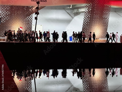 Basrah, Iraq- March 21, 2024: photo of protest iraqi people with flags beside the river photo