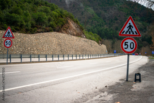 Detailed asphalt road profile: A closeup view showcasing the texture and surface intricacies of the road, inviting exploration of its unique characteristics photo