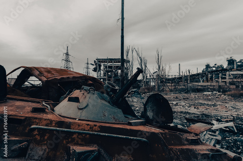 burnt tank and destroyed buildings of the Azovstal plant shop in Mariupol