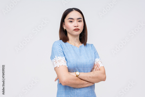 Unimpressed Asian woman with crossed arms isolated on white © Mdv Edwards