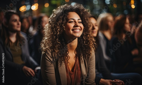 Smiling Woman Sitting in Front of Group