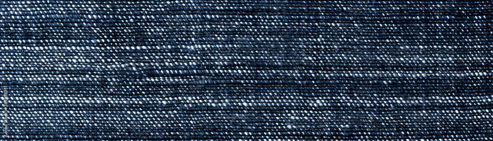 Close-up of denim fabric showing detailed texture and frayed edges - obrazy, fototapety, plakaty 