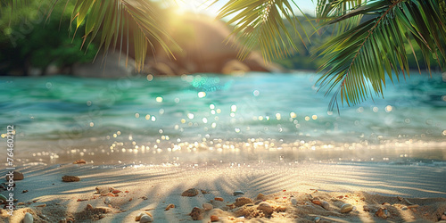 Beautiful background for summer vacation and travel. White sand of tropical beach, palm leaves and bokeh highlights on water on sunny day