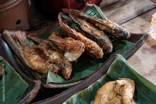 Buffet fried fish in a traditional restaurant with a Javanese joglo house concept