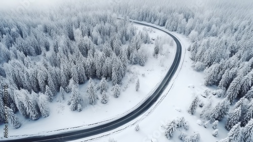 Curvy windy road in snow covered forest. © Media Srock