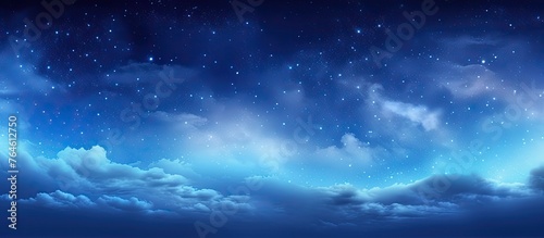 A serene night scene with a dark sky filled with twinkling stars and soft clouds drifting across the celestial background