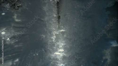 Beautiful crystal icicles, sharp ice snowflakes on stalactites inside cave  photo