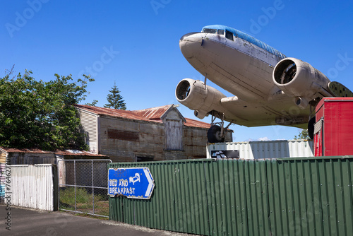 vintage airplane parked in a village, mangaweka, new zealand, aviation, bed and breakfast sign, © A