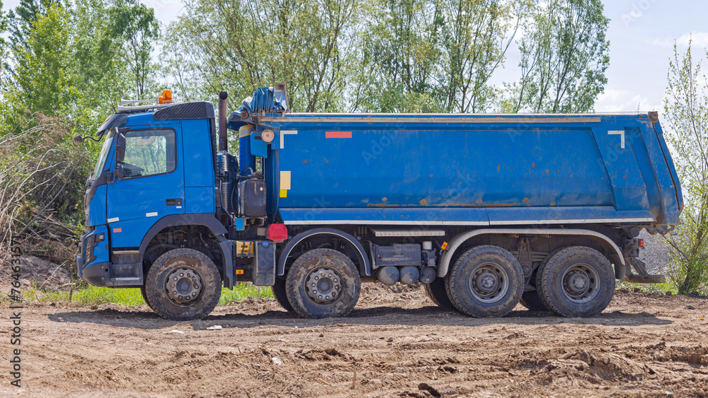 Big Blue Tipper Truck at Road Construction Site Big Blue Tipper Truck at Road Construction Site