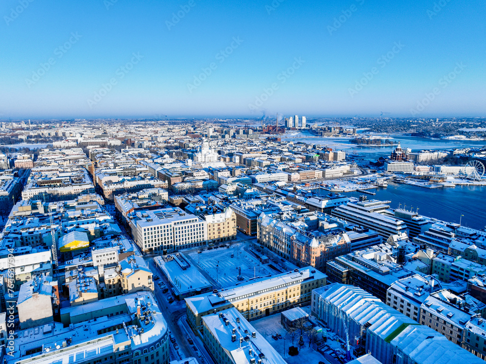 Aerial view of the south of Helsinki with the Cathedral in the background and the Kalasatama towers during winter and snowy rooftops